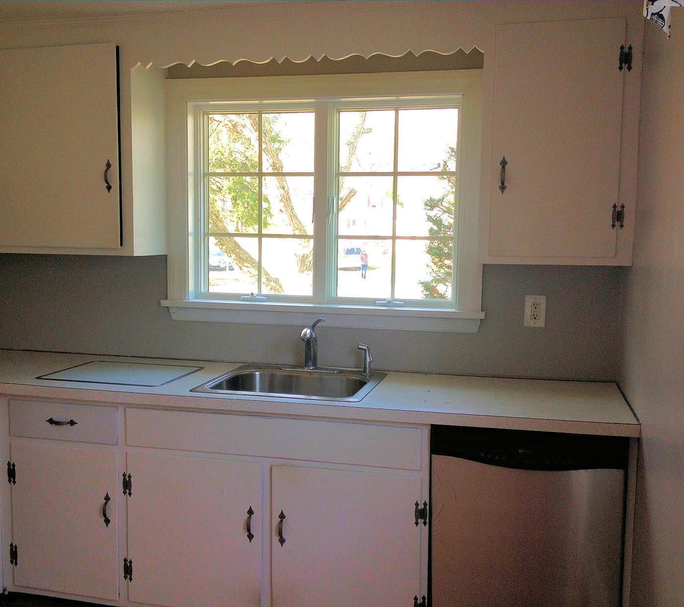 Walls painted gray and white cabinets