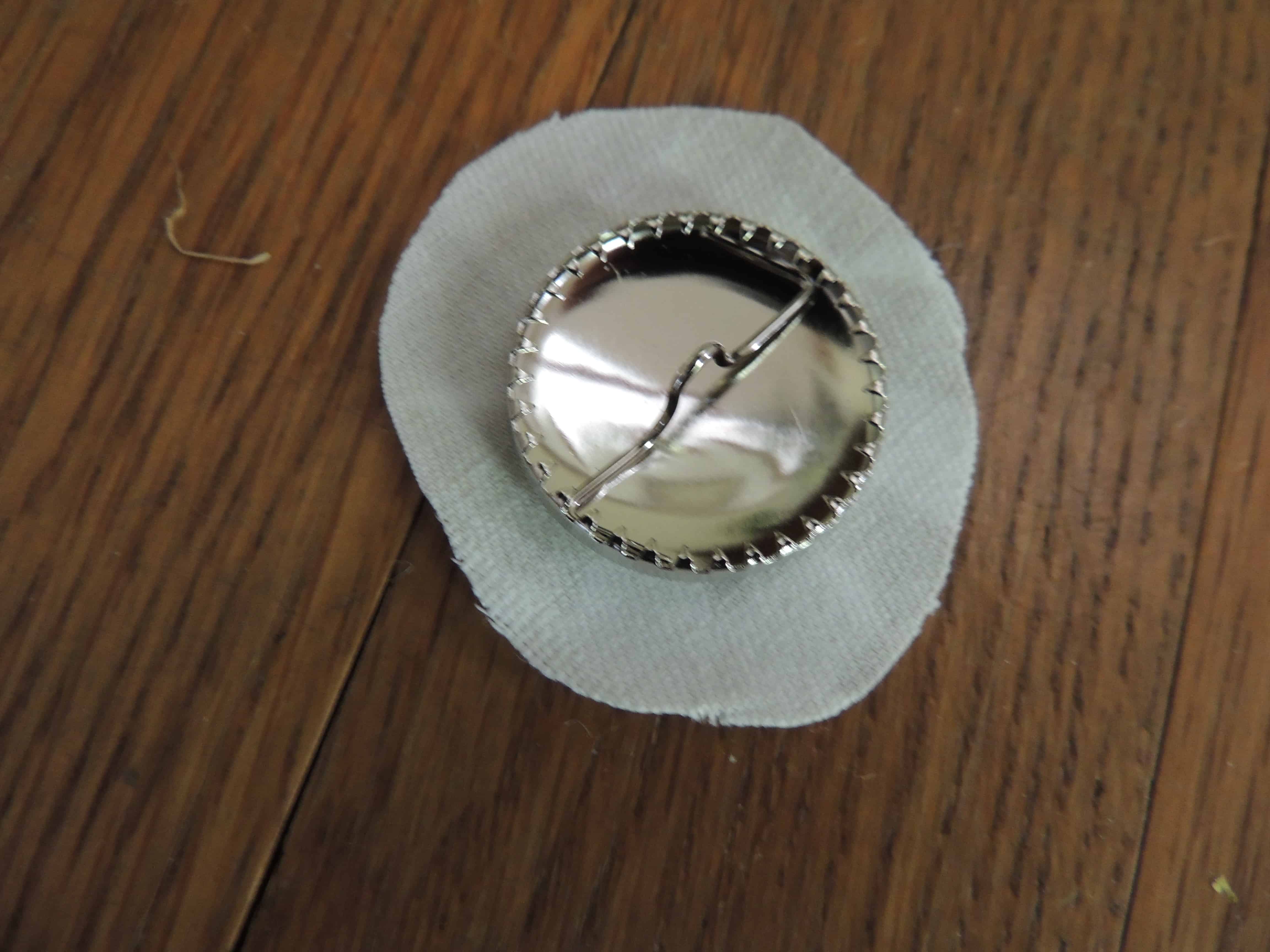 Use a small piece of fabric to cover the small button