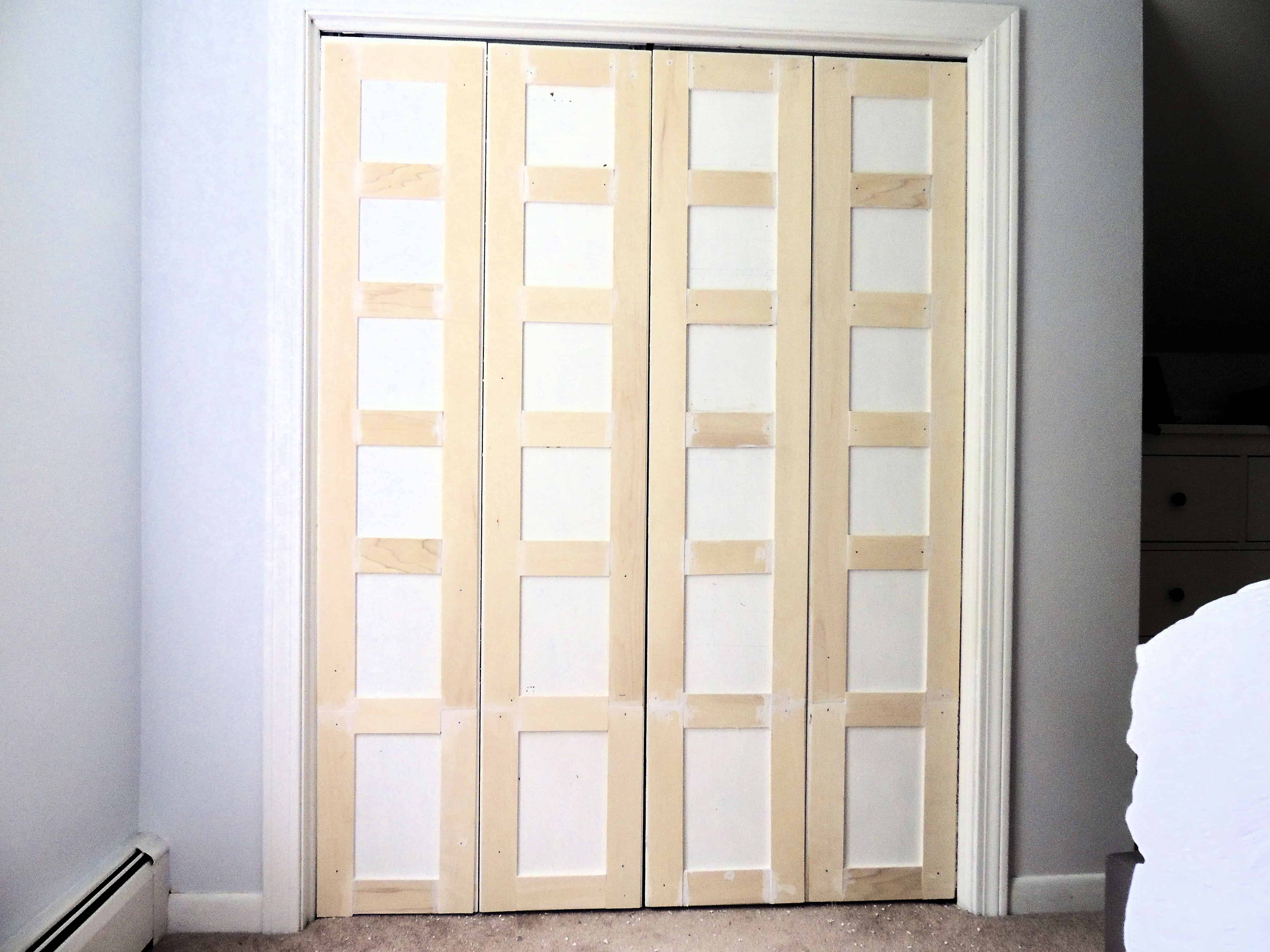 The trim pieces are attached to the doors, still unpainted. The makeover is almost complete!
