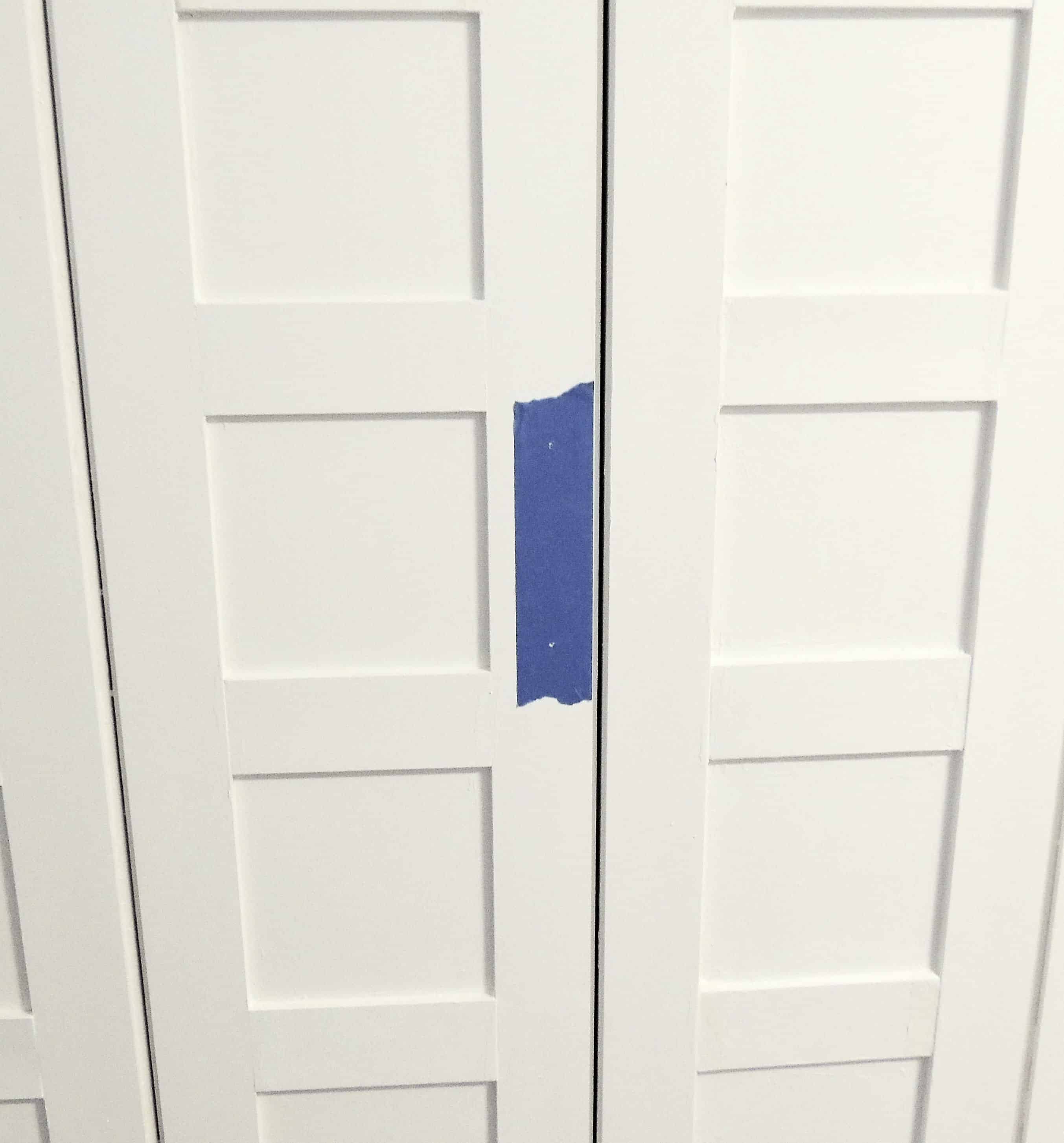 A quick tip to make a painter's tape template for aligning the door handles onto the closet doors