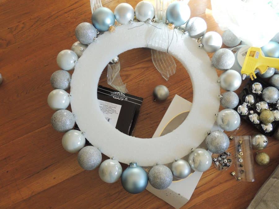 Work in progress: large ornaments attached to the outside of the wreath with a glue gun