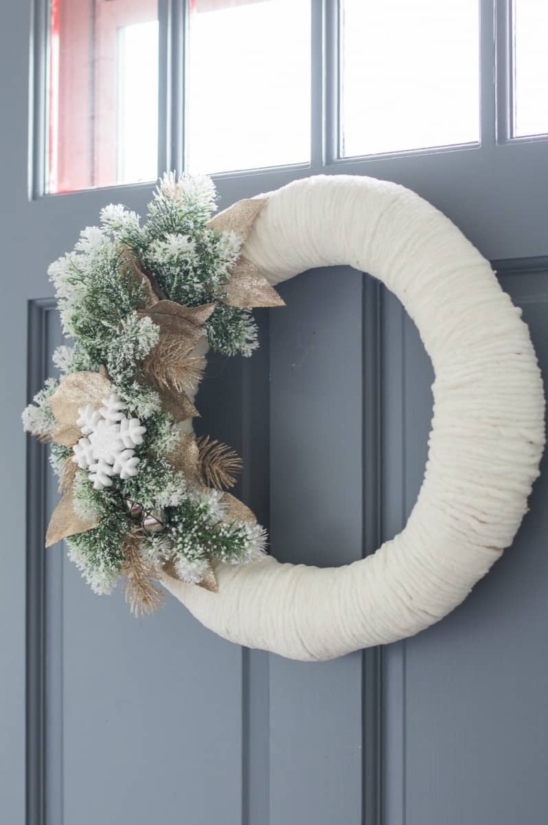 This DIY winter wreath would look great on your front door during the winter season!