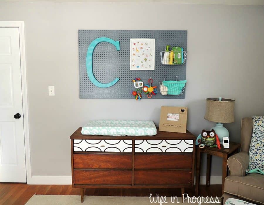 We added a pegboard to the wall in our baby boy nursery to help with organization in the changing area