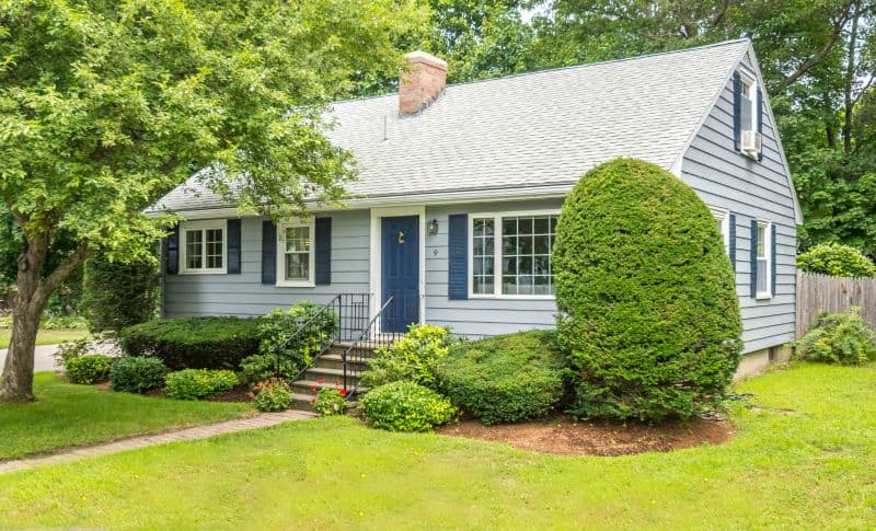 Sherwin Williams Naval front door on a small cape style house