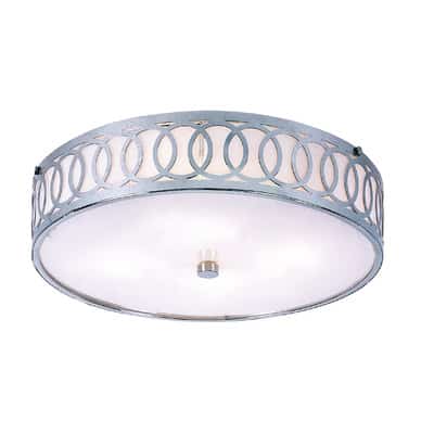 A round lamp with decorative silver edges, mounted flush to the ceiling