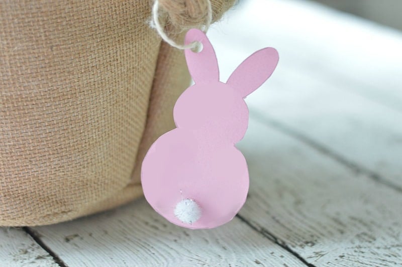 cardboard bunny gift tag hanging off an Easter basket