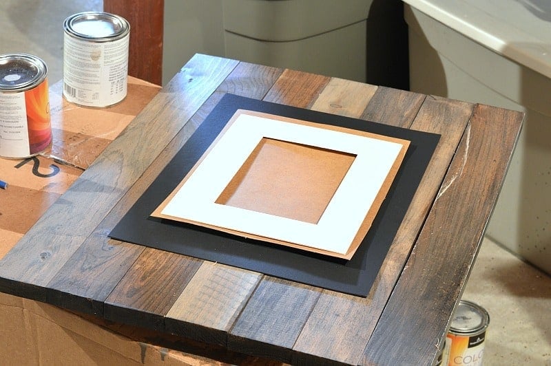 Attaching the mat to the front of the picture frame