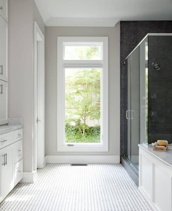 The paint colors brings warmth to a bathroom with northern light