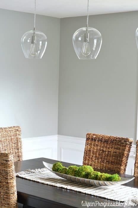 A dining table with the moss balls in a long, silver platter