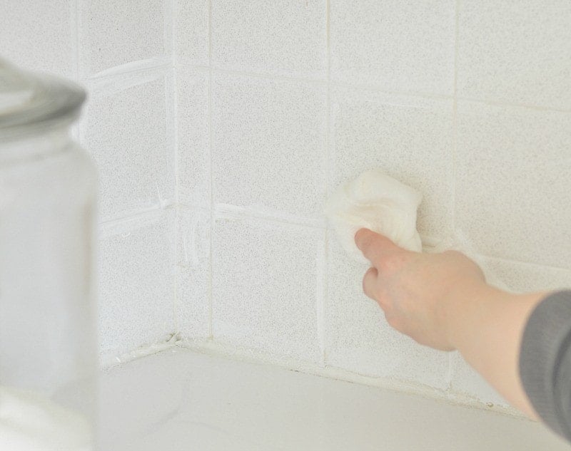 To restore tile grout, simply paint over the grout with white acrylic paint and wipe off the excess paint with a damp paper towel