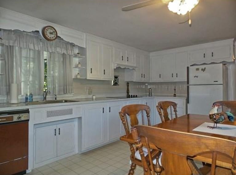 A old fashioned kitchen with a dining room table