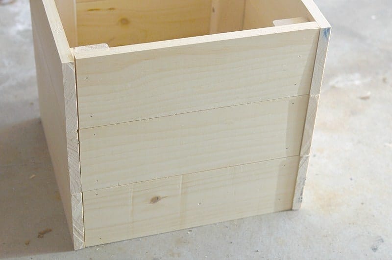 A close up of the wooden planter after the sides are attached