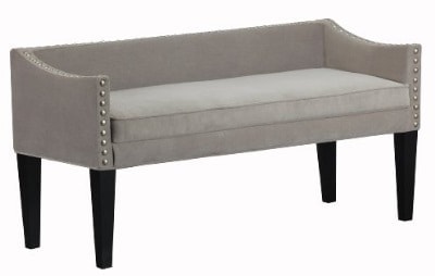 An upholstered grey bench with tapered, wooden legs