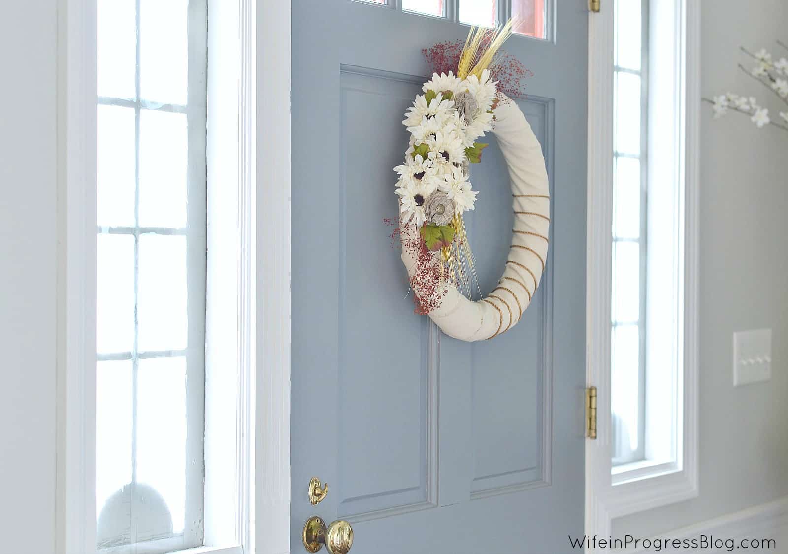 Fall wreath hanging inside front door