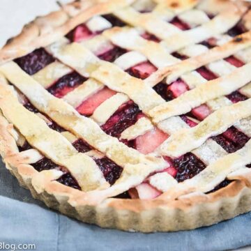 A pie with lattice strips on top, and a filling of blackberries and apples