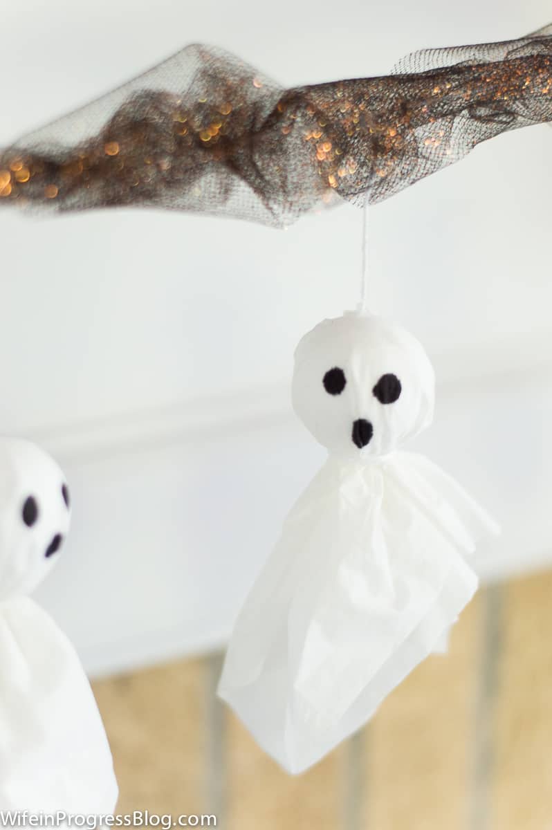 Make a simple Halloween ghost garland with tissue paper and foam balls