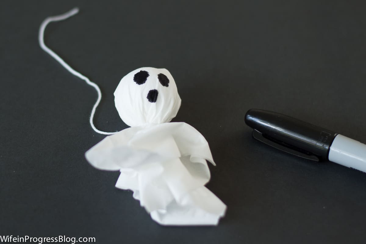 A completed tissue ghost with eyes and mouth