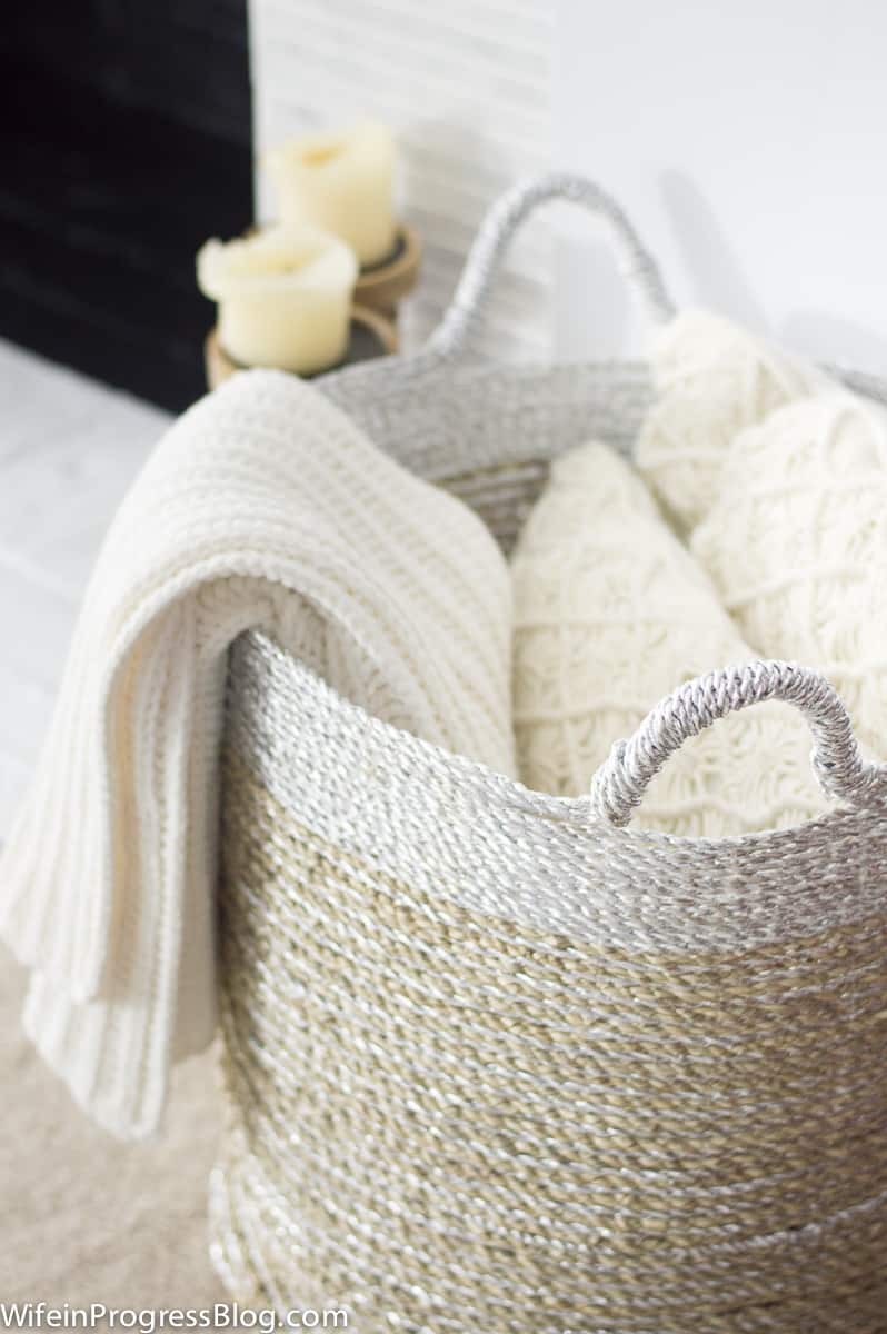 How to stay organized? Use baskets to corral pillows and blankets and keep your bedroom organized and tidy 