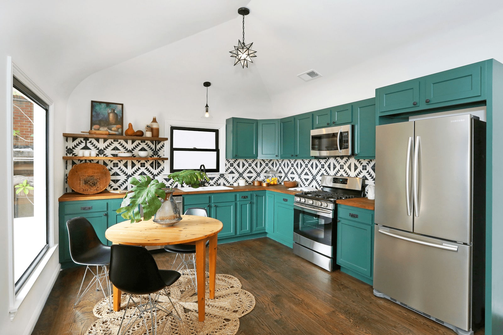 Trendy kitchen with green cabinets