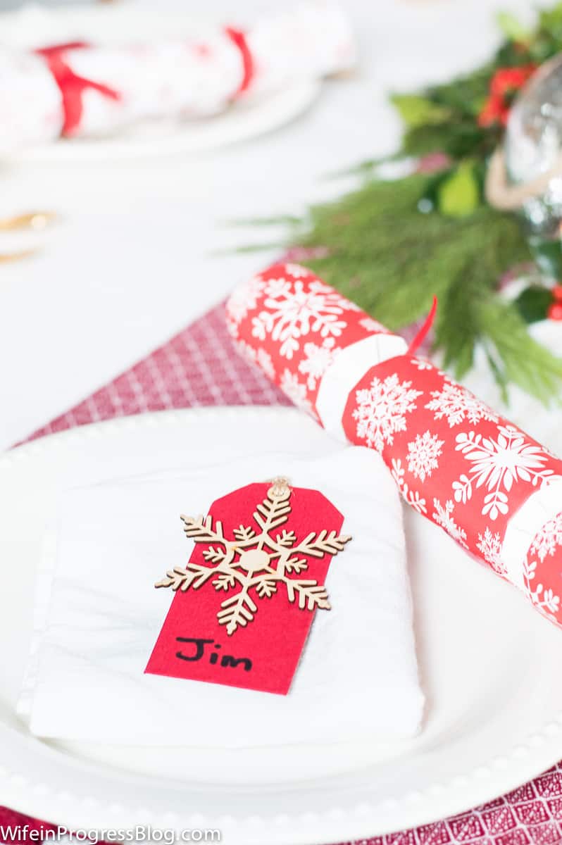 Be creative with your Christmas table decorations. Instead of expensive napkin holders and fancy name tags, use gift tags!