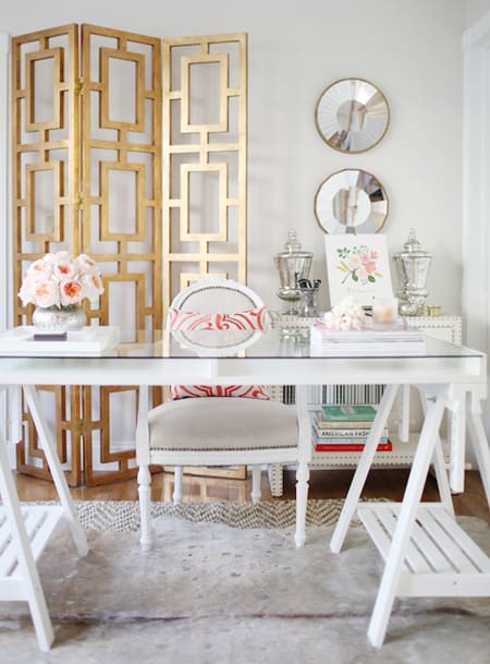 Consistently using mixed metals throughout your room, like the gold in this office