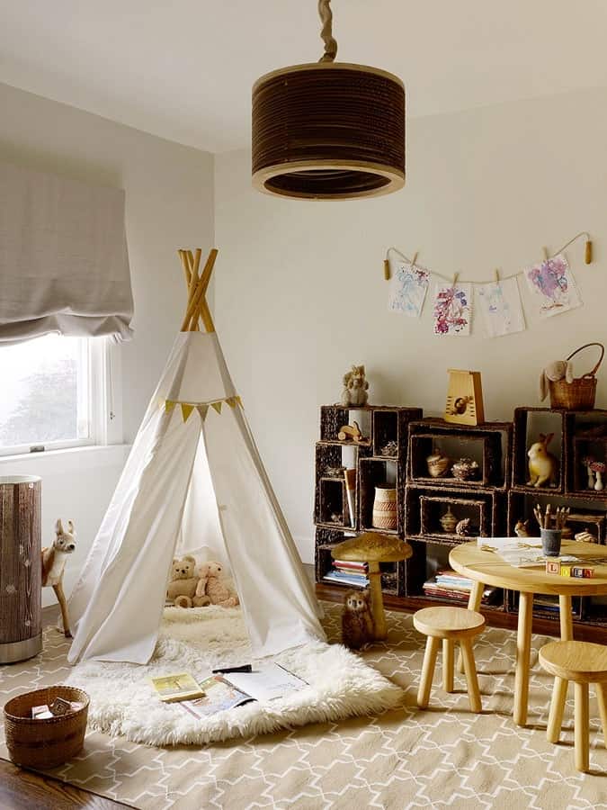 Kids' playroom with a table and chairs and tee-pee