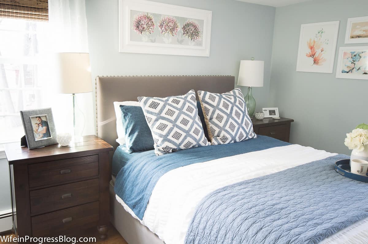 This cozy winter bedroom decor uses warm shades of blue and comfy patterns to give this bedroom a winter refresh