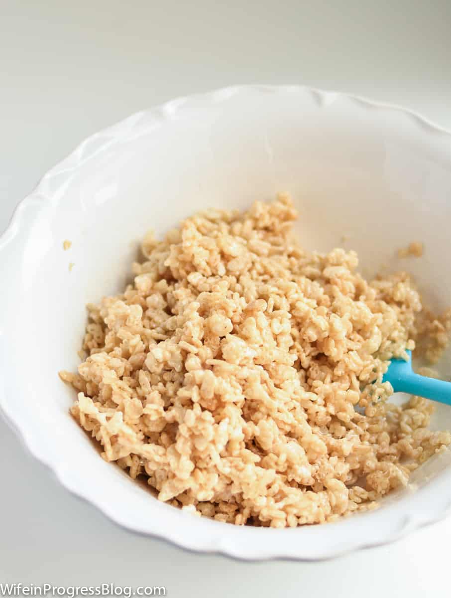 Rice Krispies and butter mixed together in a bowl