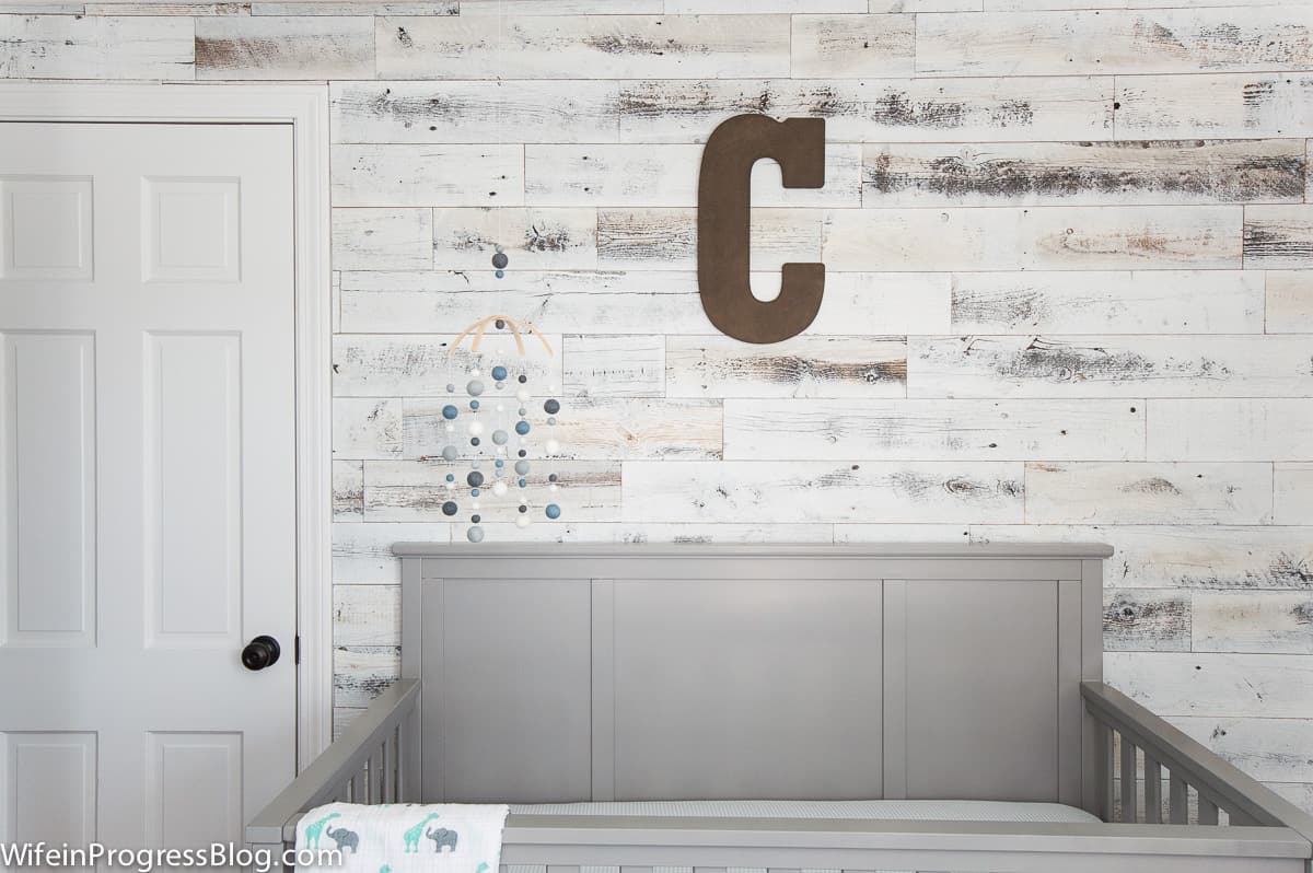 planked walls add charm and interest to a cookie cutter room