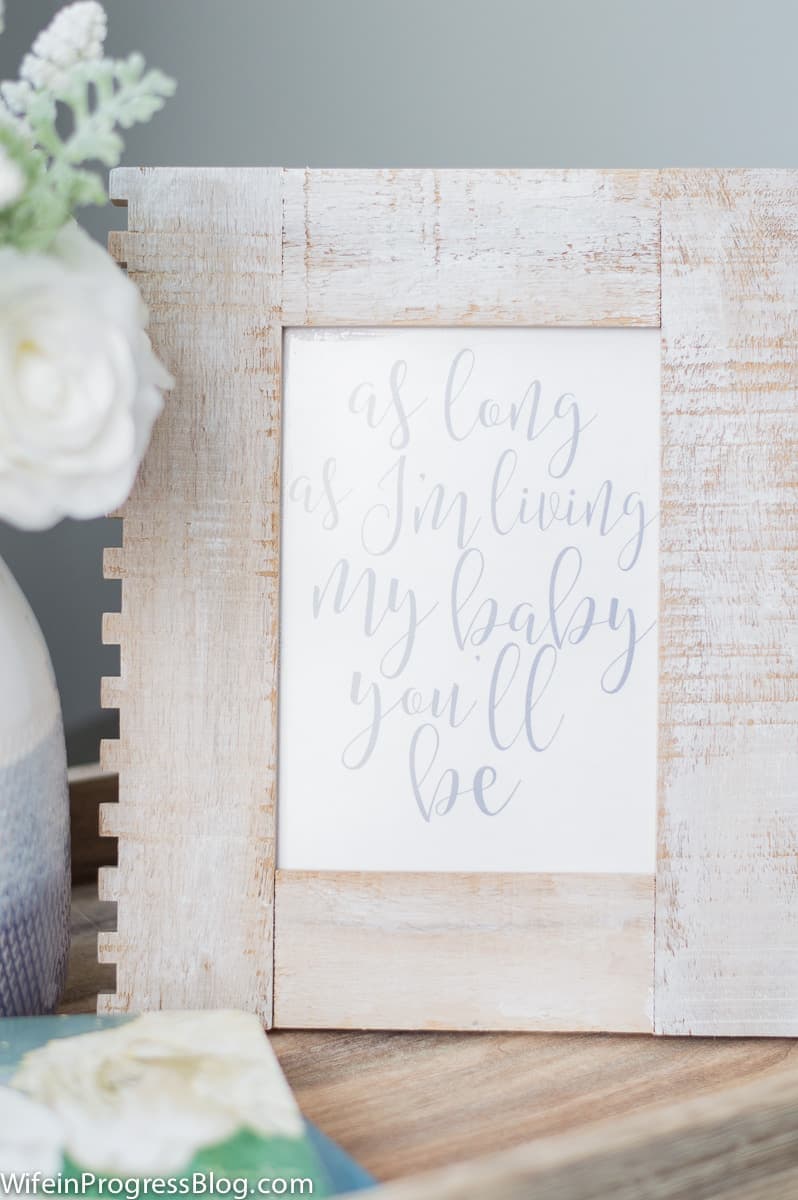 Gray and blue baby boy nursery with rustic, industrial touches like this wooden frame with meaningful quote