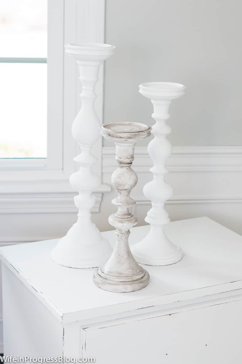 The first candlestick after the antiquing wax looks like real, weathered wood, as compared to the other two, simply painted with white chalk paint.