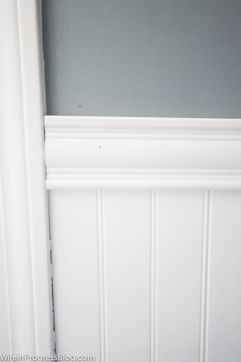 A closer look at vinyl beadboard and matching chair rail below a gray wall