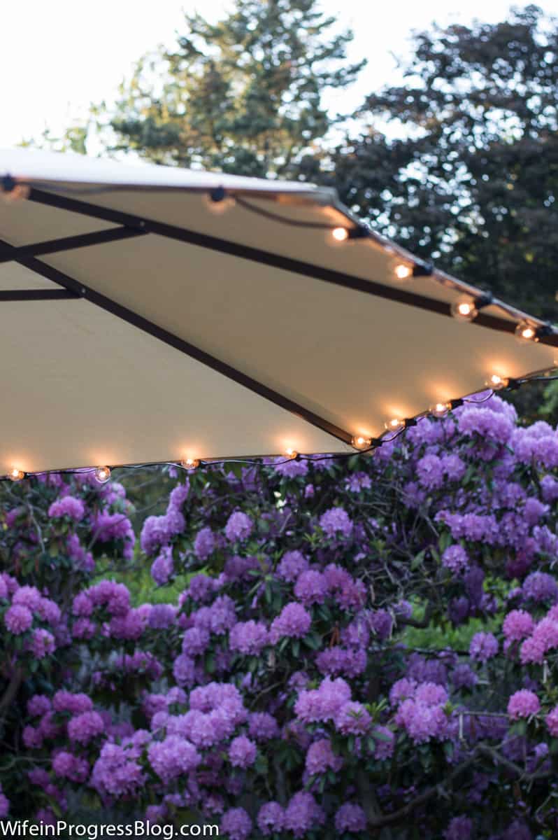Add inexpensive string lights to an umbrella for instant ambience