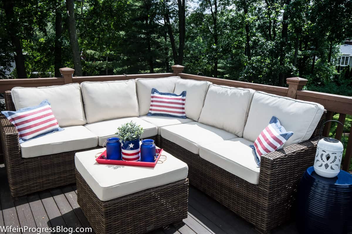 Patriotic pillows on cream sectional set outdoors