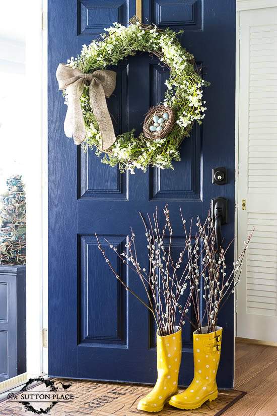 Front door with wreath painted in the color Naval by Sherwin Williams