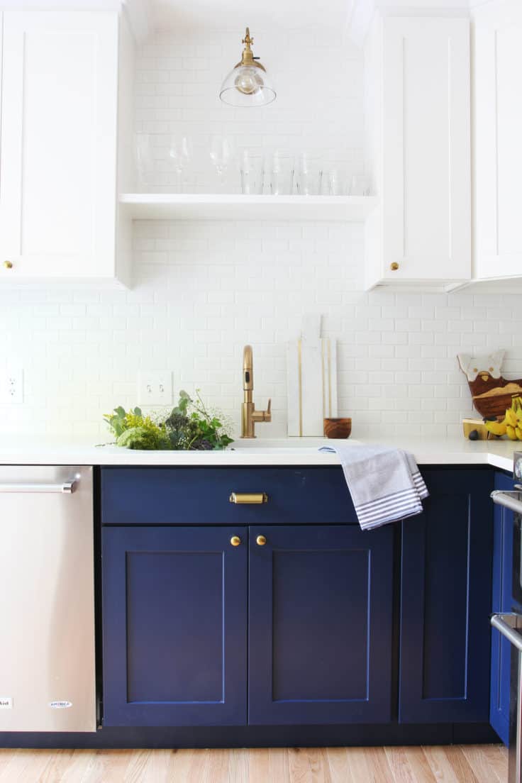 Two toned kitchen cabinets with white uppers and Naval base cabinets