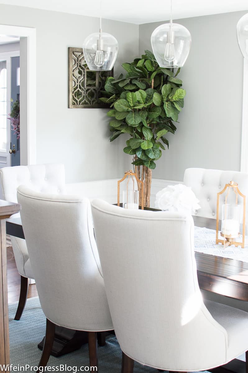 Neutral dining room with gold accents
