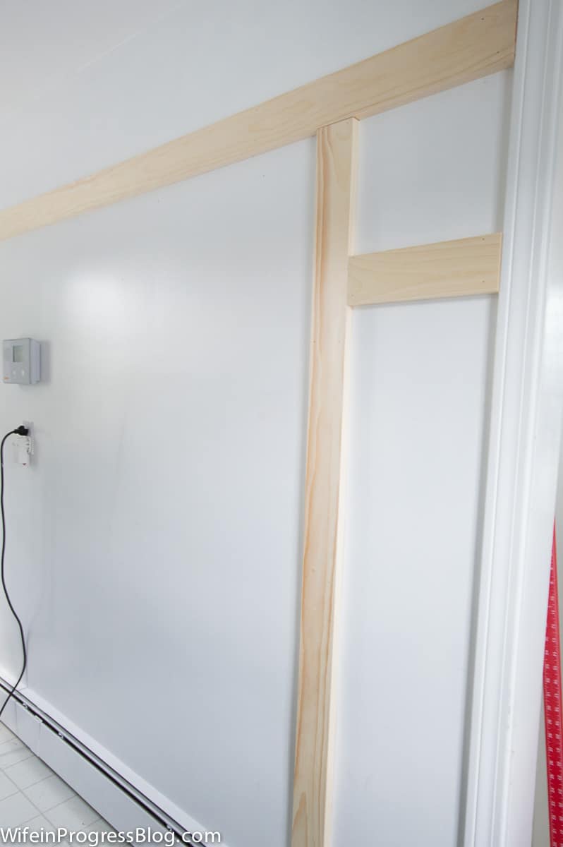 Installing board and batten is cheap and easy, it can even be installed to textured walls