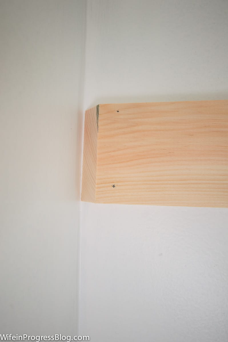 A mitered edge to join the corners of the board and batten