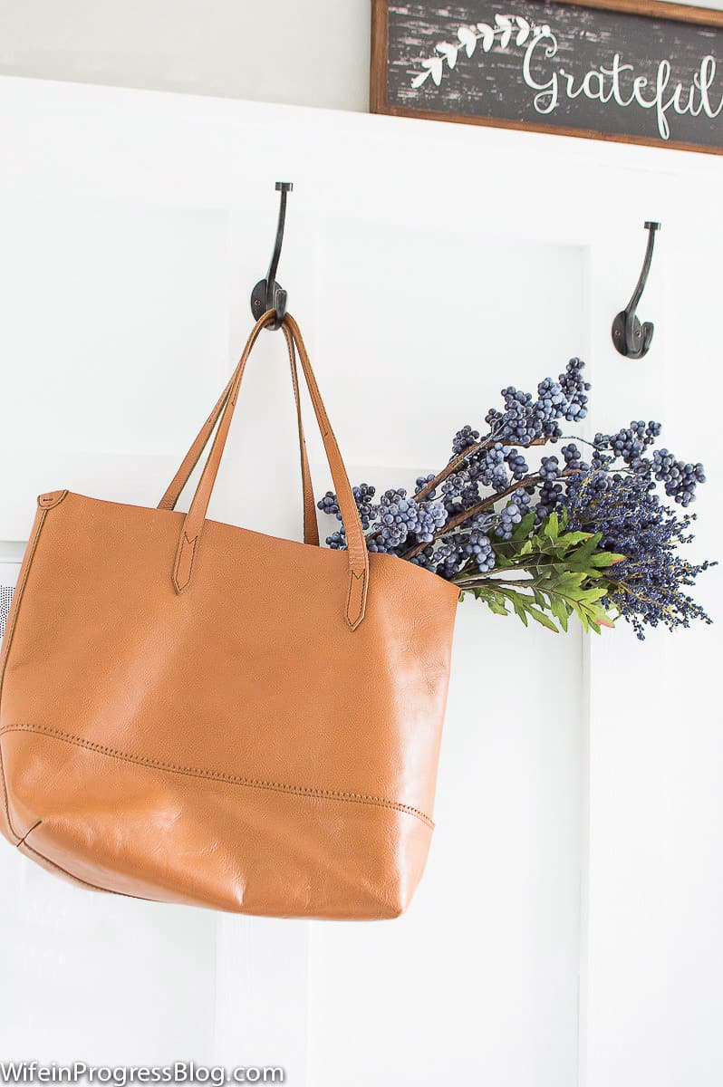 Add flowers to a bag for simple mudroom decor