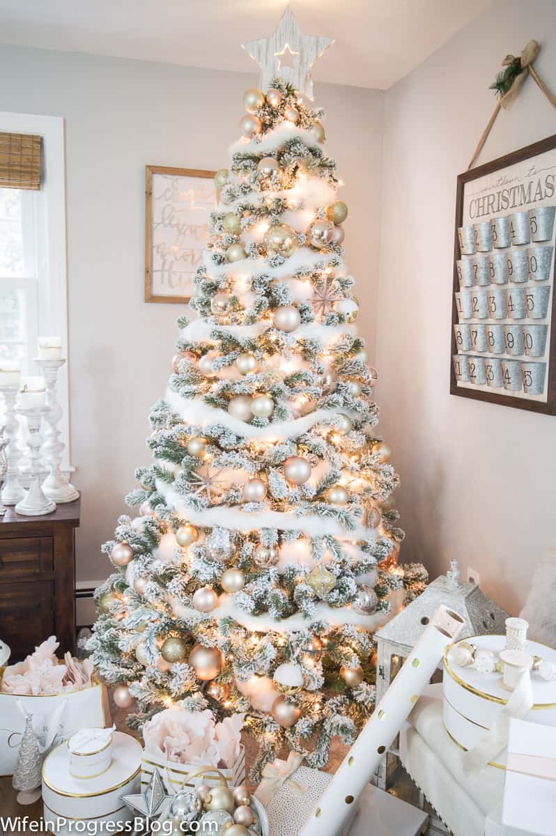 Flocked Christmas tree with white and rose gold ornaments