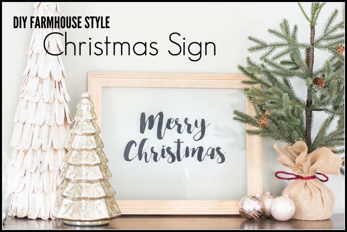 DIY Farmhouse Style Christmas Sign - the words \"Merry Christmas\" written in black on a glass background, framed in wood