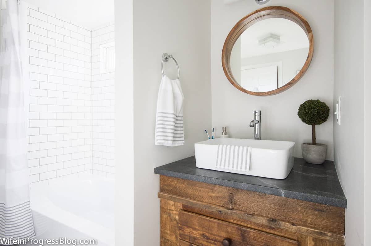 Modern farmhouse style bathroom with rustic wood and walls painted Benjamin Moore Paper White