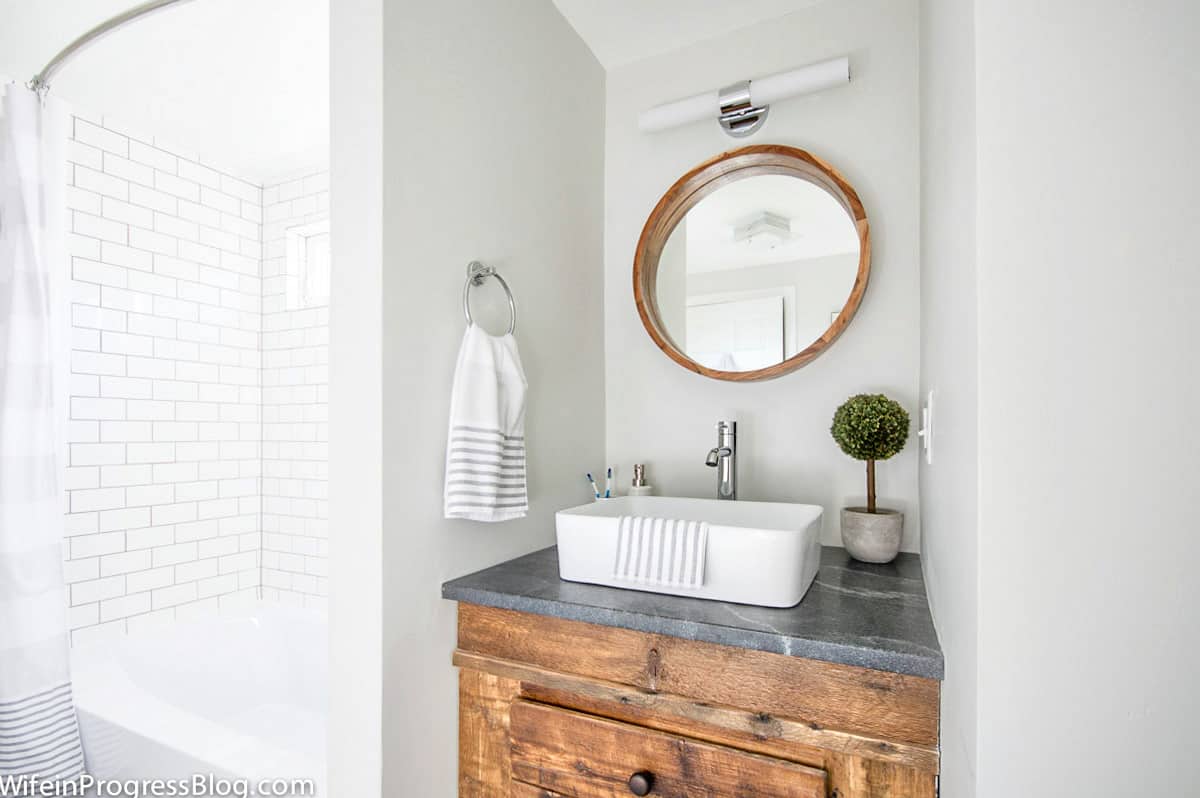 This modern farmhouse bathroom is painted a light gray color - Paper White by BM and it's perfectly light with no undertones