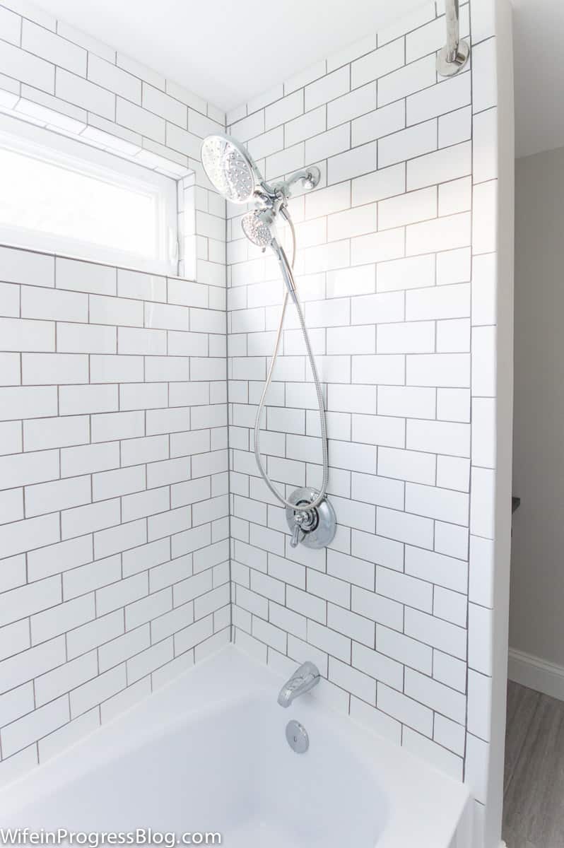 White subway tile, gray grout and chrome hardware. This used to be all pink! A pink bathroom gets a modern vintage makeover