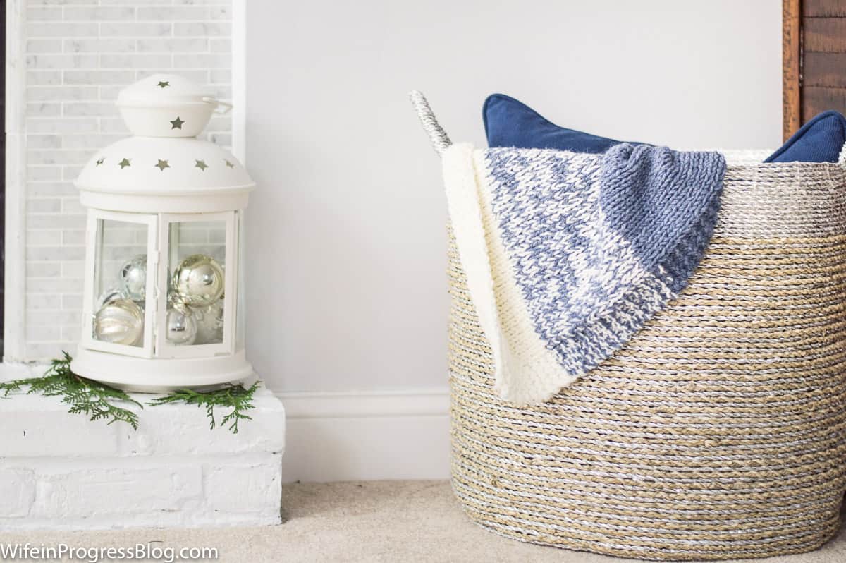 Basket with throw blankets hanging out