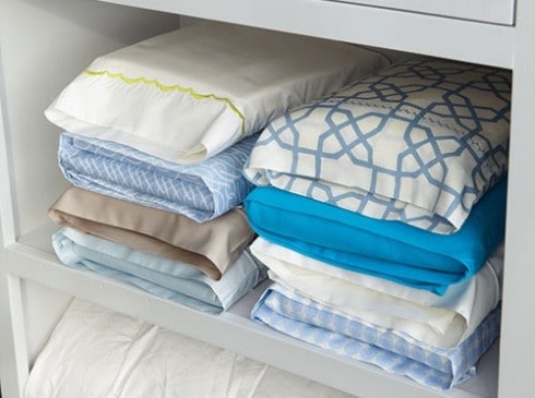 Store sheets inside a pillowcase to keep your linen closet organized