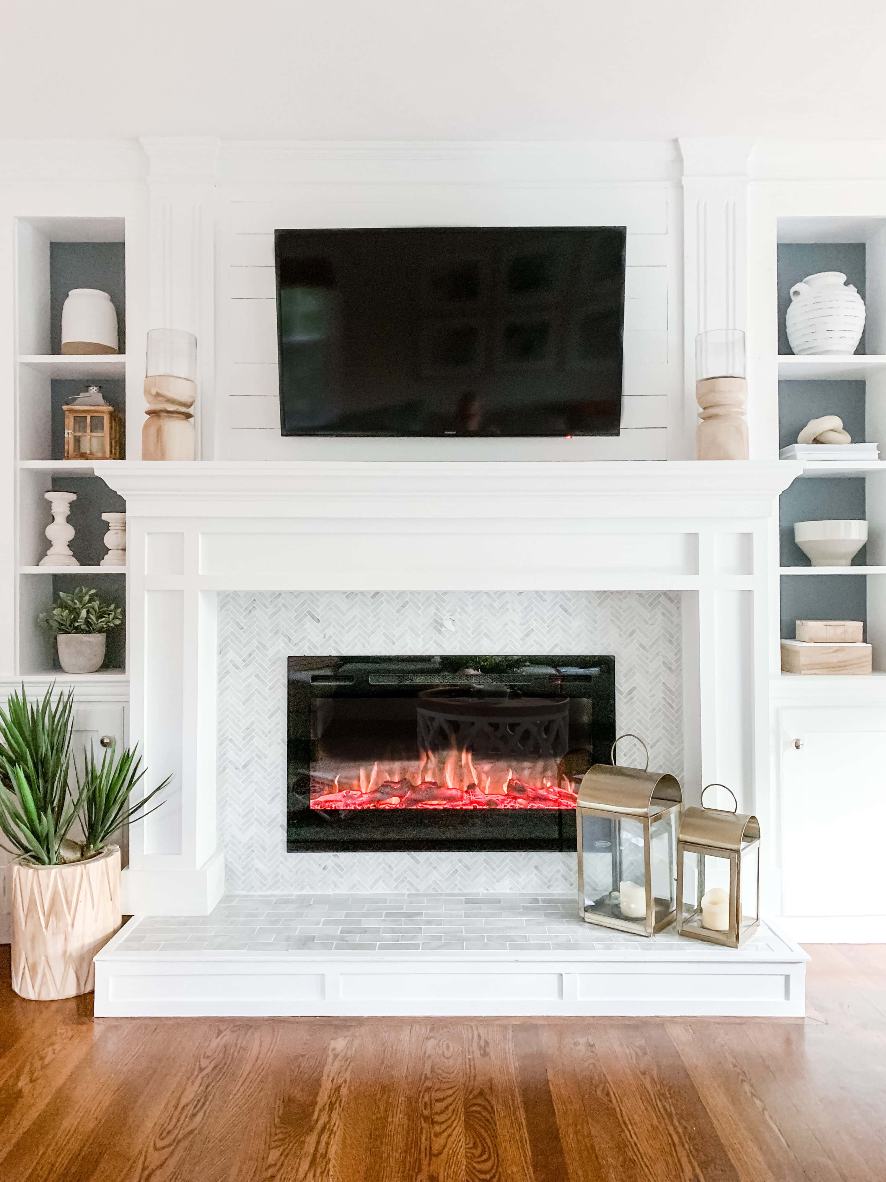 The focal point of this living room is the fireplace with TV over it