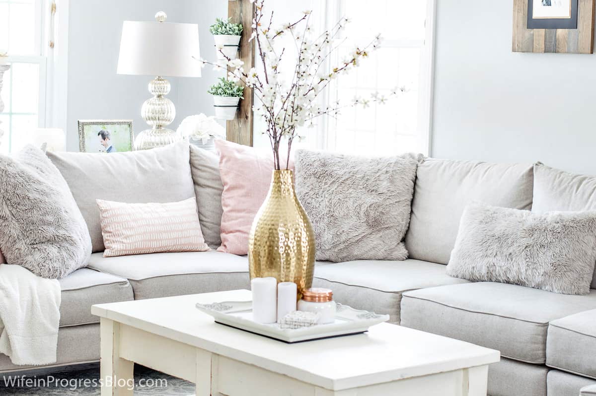 Keeping your decor minimal with more muted colors is a great way to create a cozy feeling in your living room this winter