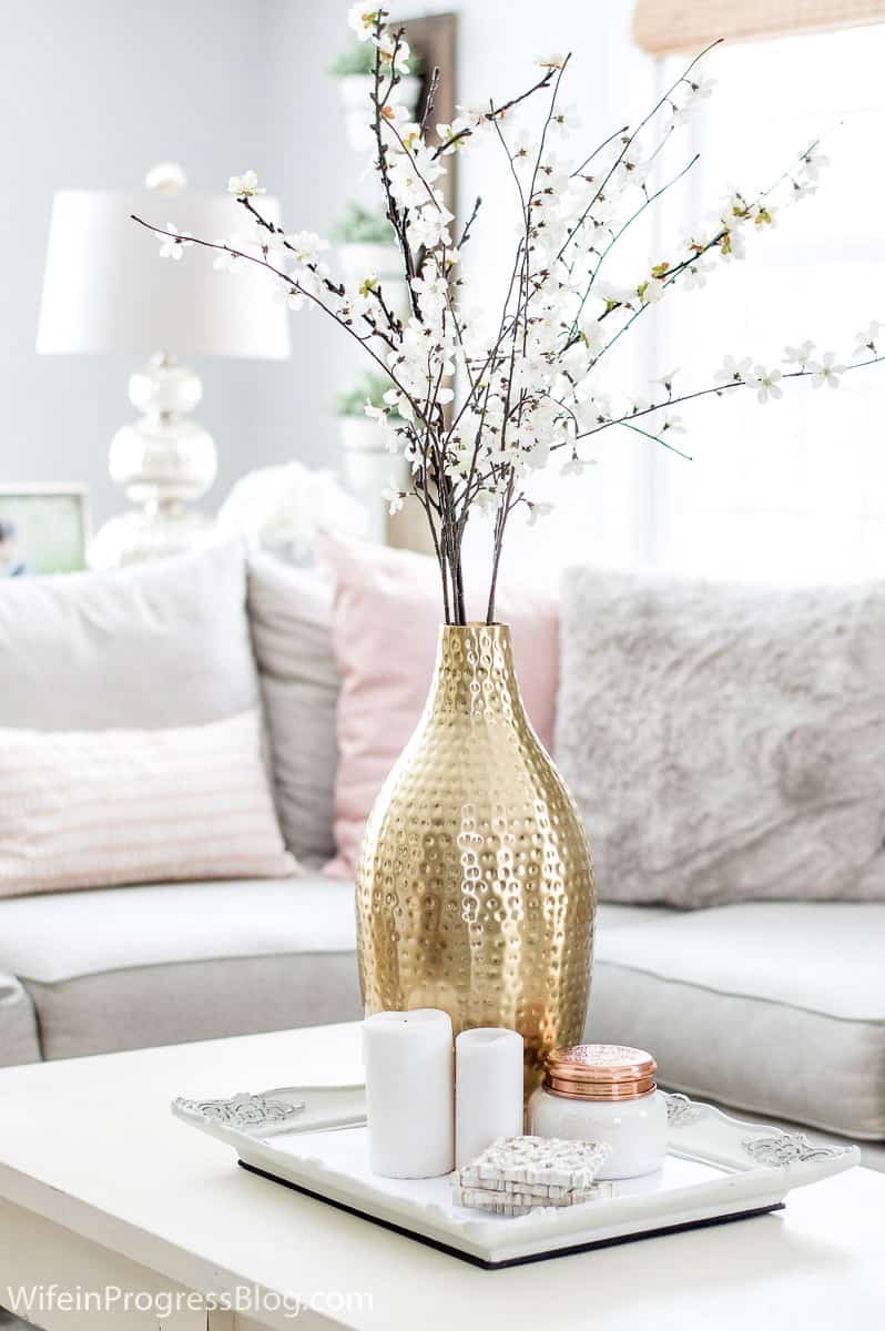 Flowers, plants and tree clippings add a natural touch to winter living room decor